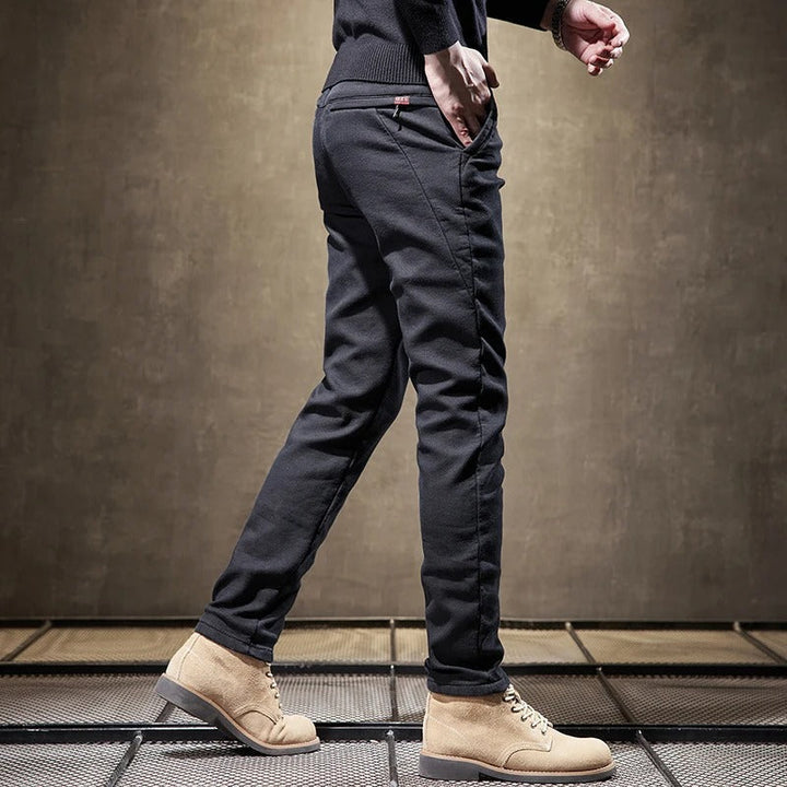 Close-up of the fabric texture on men's slim-fit casual chino pants, highlighting quality and comfort.