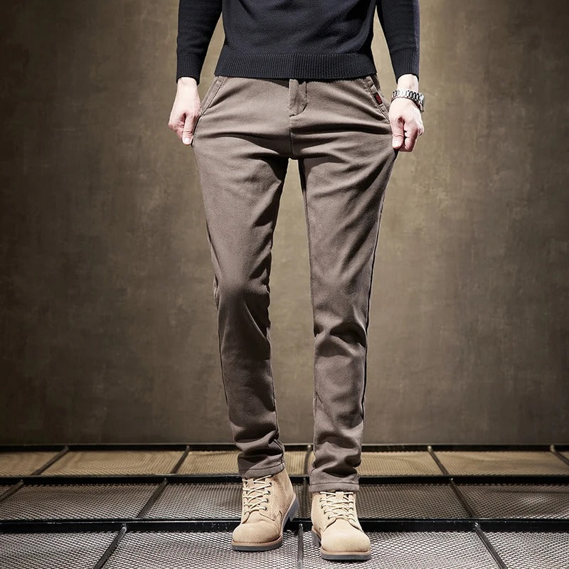 Men's slim-fit casual chino pants paired with a t-shirt, demonstrating a relaxed, versatile look.