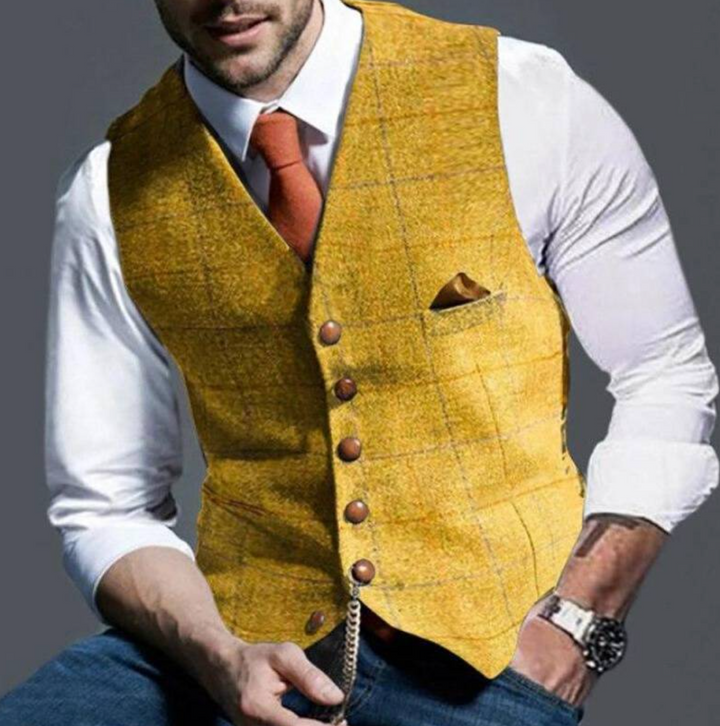 Close-up of a men's dress vest, highlighting the elegant notch lapel, button details, and pocket square.