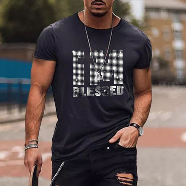Man wearing a black slim fit t-shirt with a dazzling rhinestone crown graphic, trendy streetwear look.