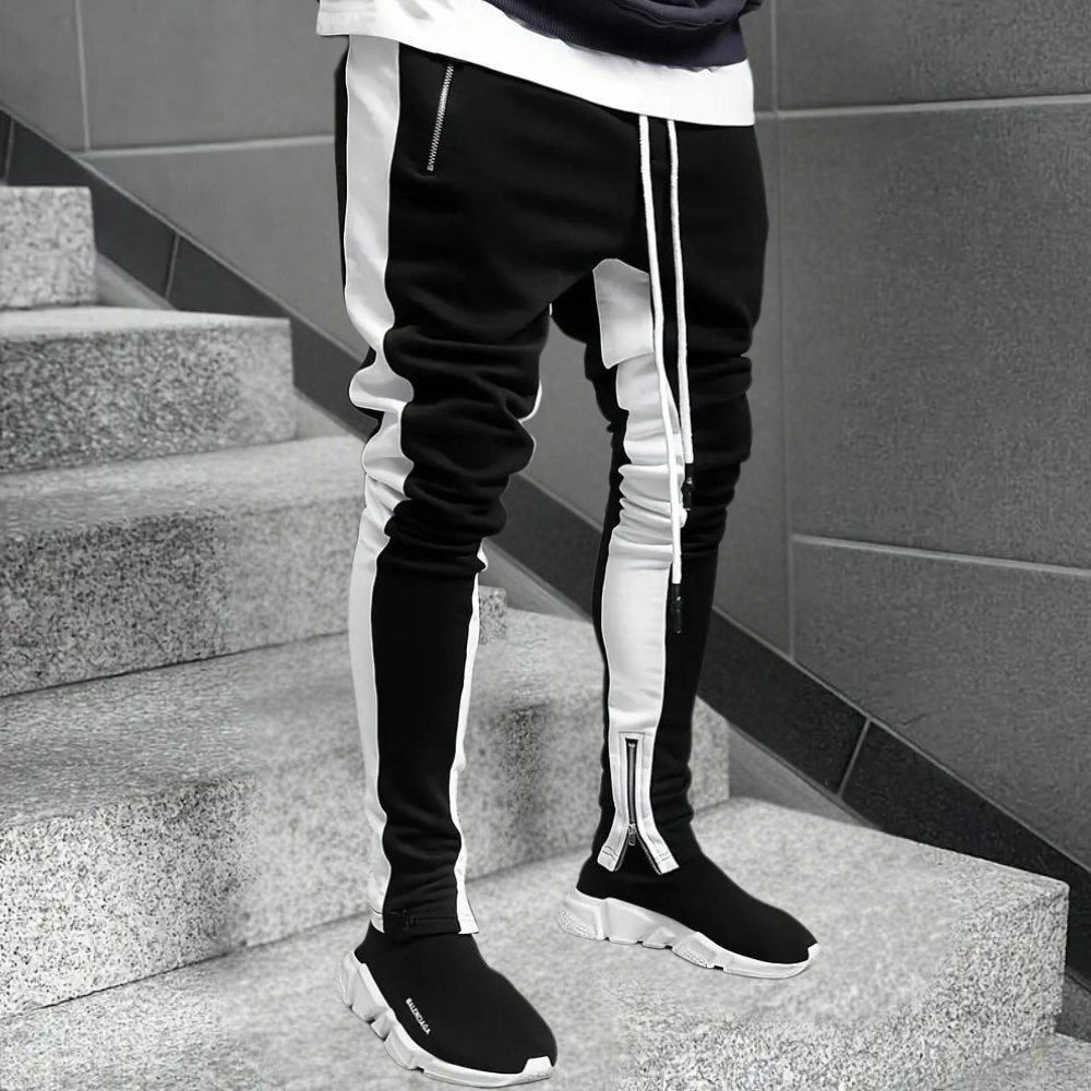 Versatile men's streetwear joggers, slim fit with contrast panels, ideal for casual wear or active gym sessions.
