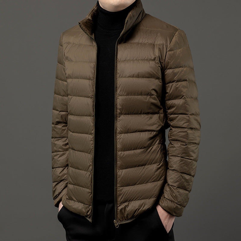 Men's slim-fit lightweight puffer jacket for casual everyday style. Perfect fall/winter outerwear.