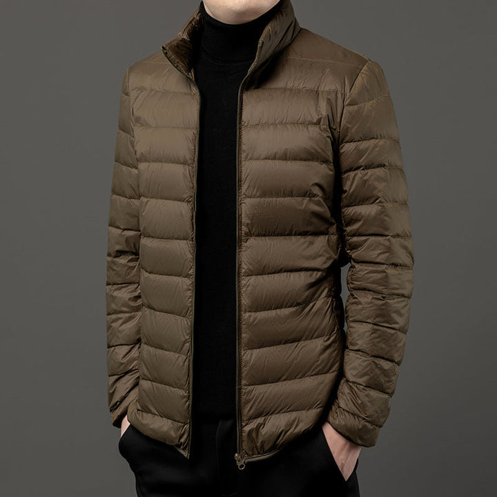 Men's slim-fit lightweight puffer jacket for casual everyday style. Perfect fall/winter outerwear.
