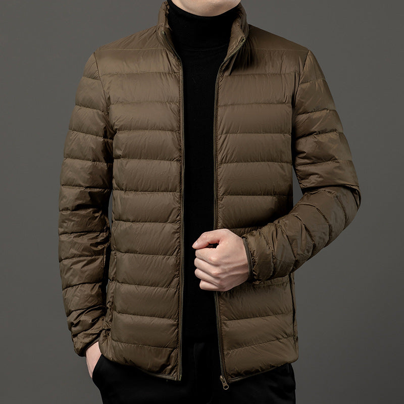 Men's quilted puffer jacket with stand collar. Slim-fit & lightweight for fall/winter outerwear.