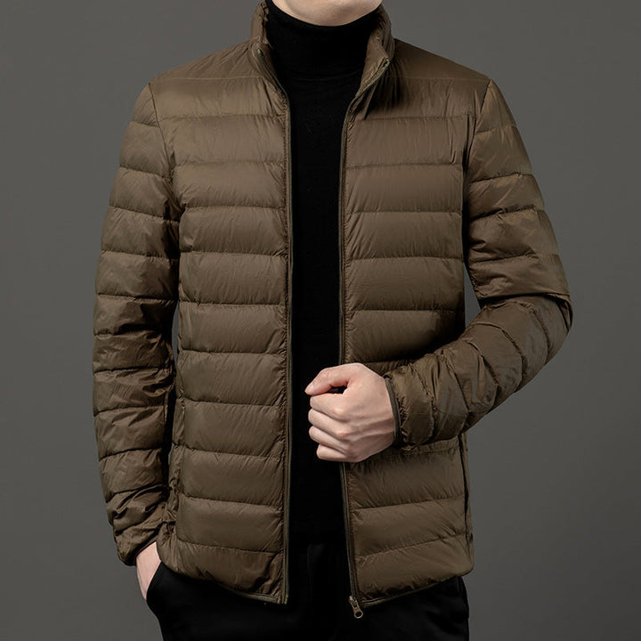 Men's quilted puffer jacket with stand collar. Slim-fit & lightweight for fall/winter outerwear.