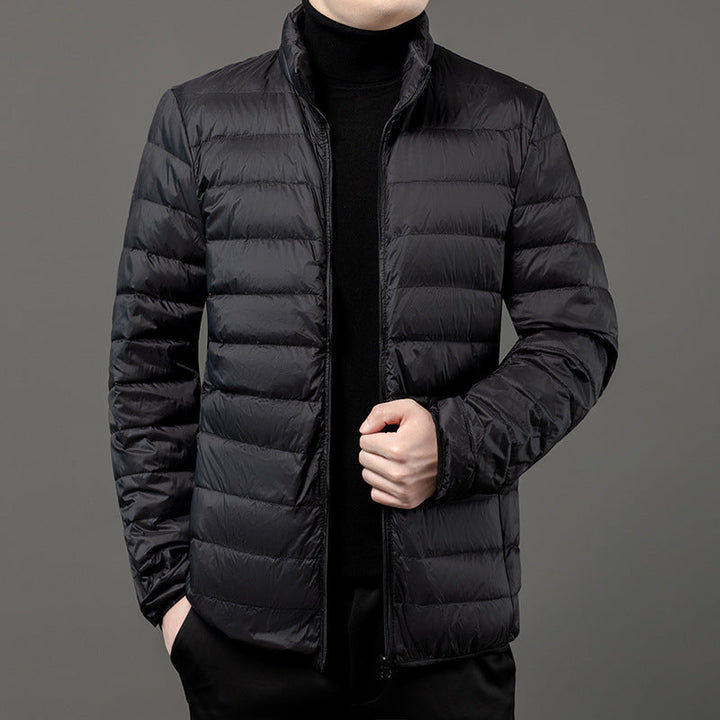 Lightweight men's puffer jacket, slim-fit design. Ideal quilted outerwear for winter/fall casual style.