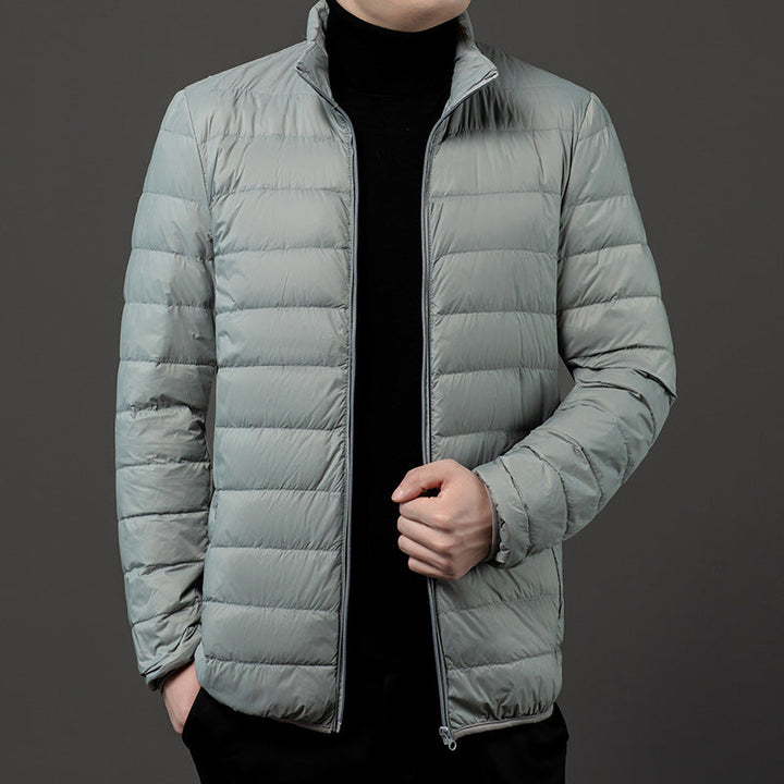Men's slim-fit quilted puffer jacket with stand collar. Lightweight outerwear for fall & winter.