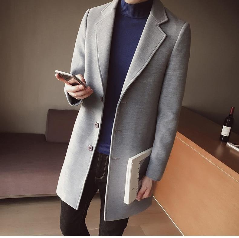 Stylish men's slim fit long coat. A classic elegant statement piece for formal or smart casual fashion.
