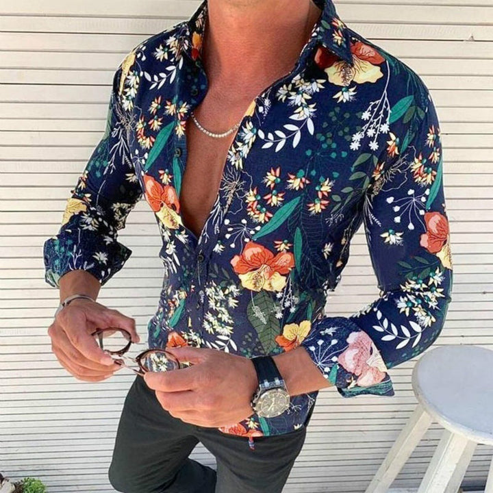 Detailed view of cuff on men's long sleeve floral shirt, stylish for casual & party fashion.