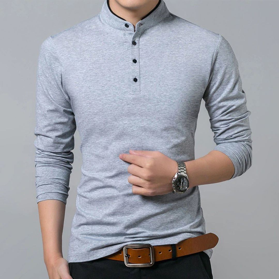 Detailed view of men's slim-fit long sleeve polo, showcasing its refined mandarin collar & comfortable fabric.
