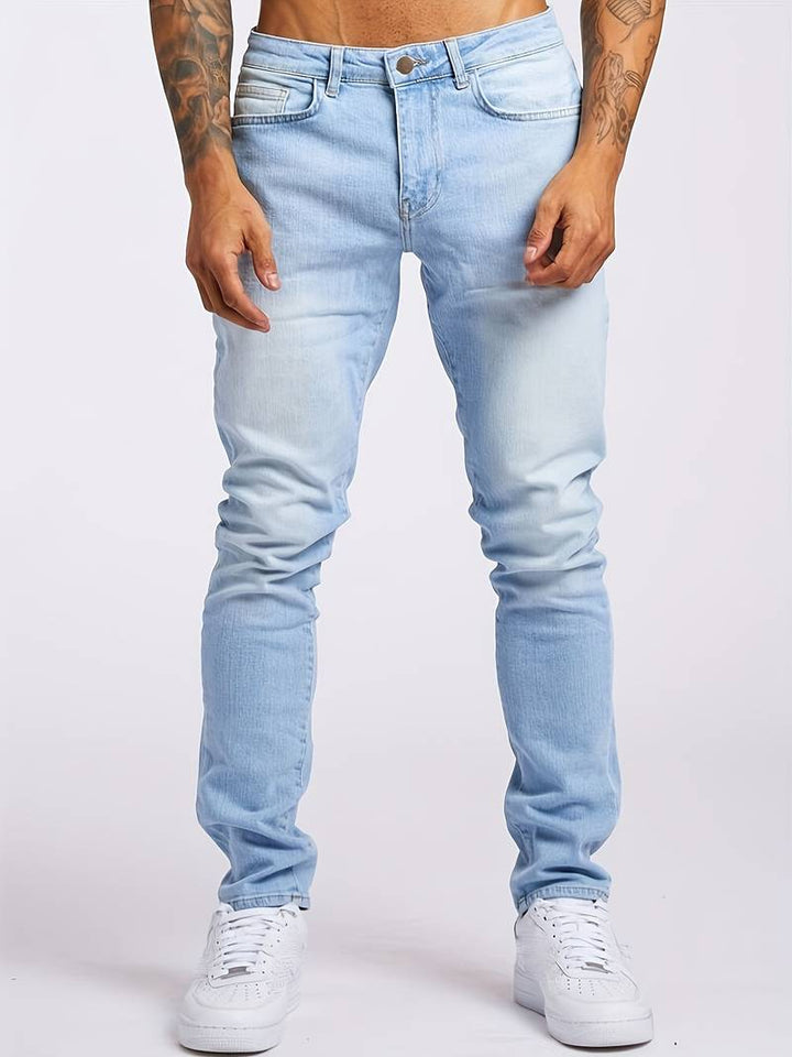 Sleek men's slim fit jeans. Classic five-pocket design, ideal for streetwear and modern casual men's fashion.