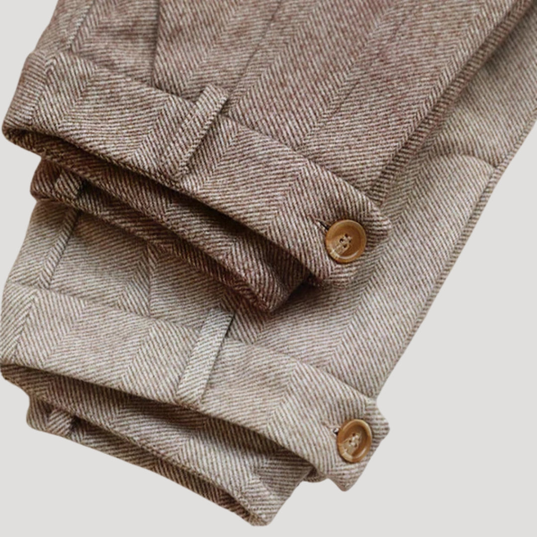 Close-up of beige tailored men's ankle-length casual pants fabric texture