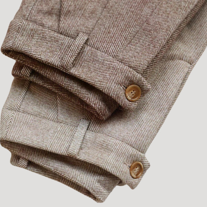 Close-up of beige tailored men's ankle-length casual pants fabric texture
