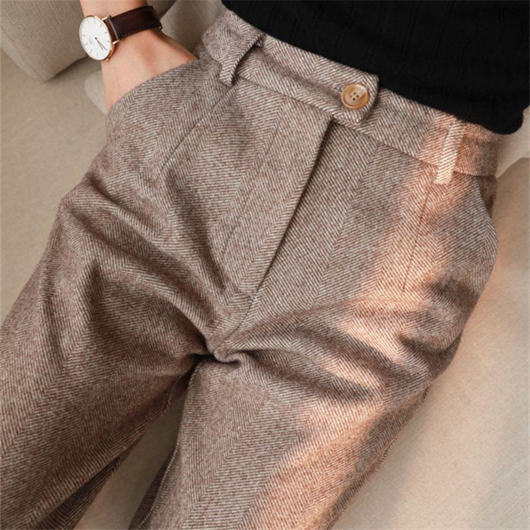 Model wearing slim fit tailored ankle-length men's casual pants in brown