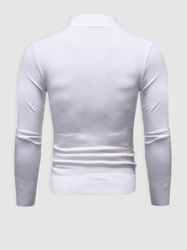 Man wearing a dark slim fit turtleneck sweater, embodying modern men's casual style.