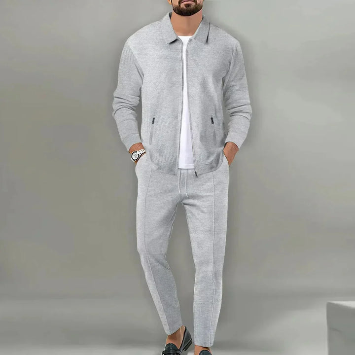Stylish men's slim fit suit with matching blazer and trousers, ideal for sharp business & party attire.