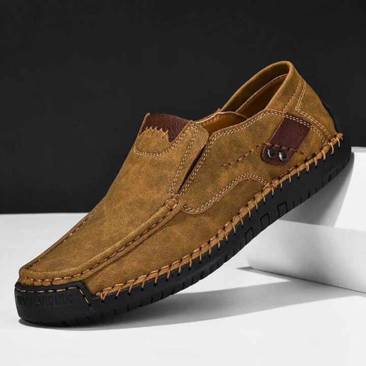 Brown men's slip-on shoes with arch support, designed for stability and easy, comfortable daily wear.