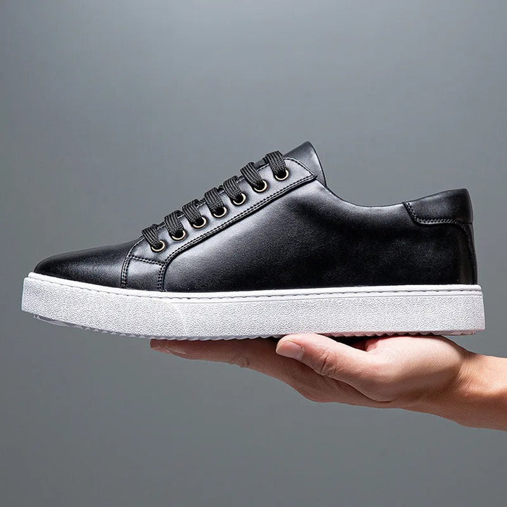 Men's smart casual black lace-up trainers. Sleek low-top sneakers, versatile for everyday style.