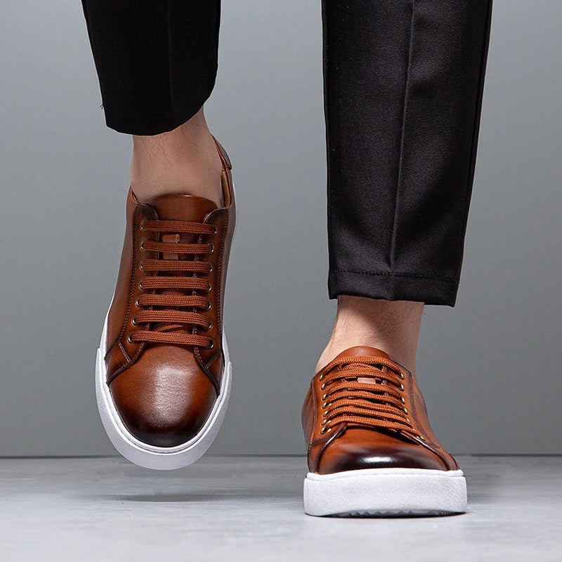 Men's smart casual brown lace-up trainers. Versatile low-top sneakers for a sleek everyday look.