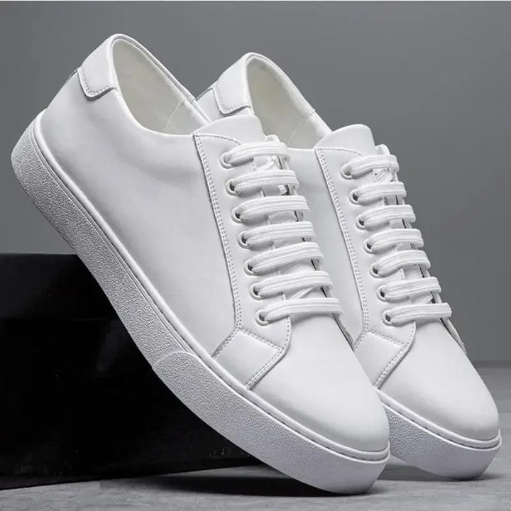 Black men's smart casual lace-up trainers. Sleek low-top design for versatile everyday fashion.