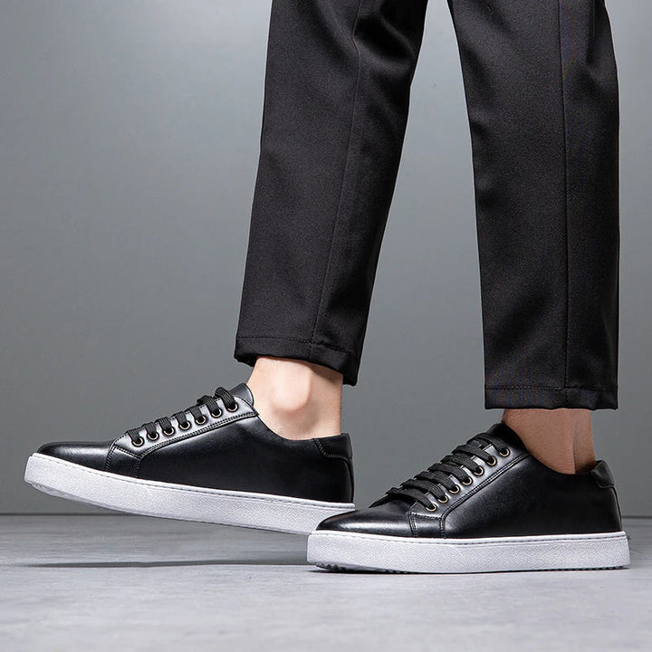 Modern men's smart casual low-top trainers. Sleek lace-up sneakers for versatile use.