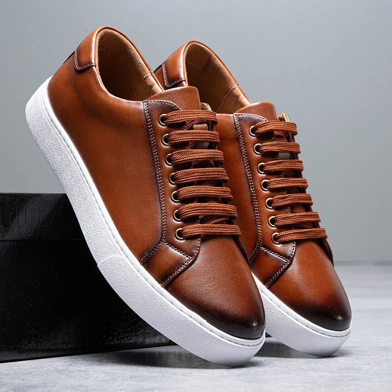 Men's smart casual grey sneakers. Sleek low-top lace-up trainers for versatile style.