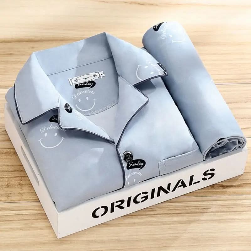 Man relaxing comfortably in a breathable button-up pajama set, ideal men's loungewear for unwinding.