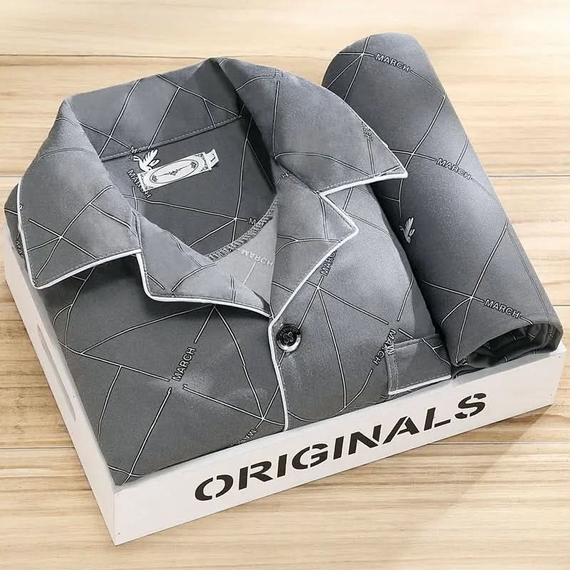 Man sleeping soundly in a soft men's button-up pajama set, designed for restful and comfortable sleep.