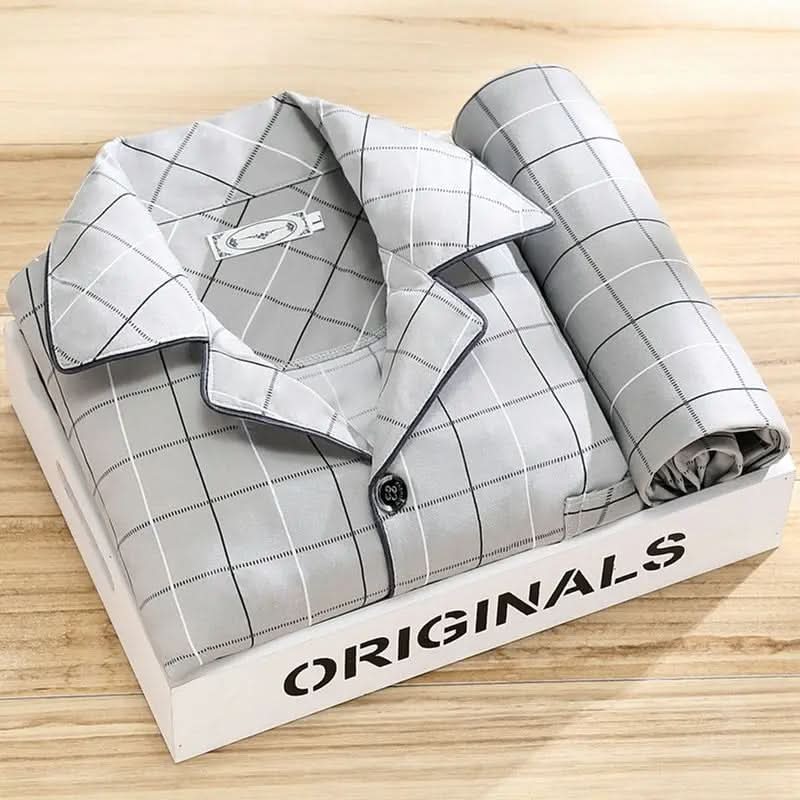 Detail of the classic button-up front and collar on a stylish men's soft pajama set, quality sleepwear.