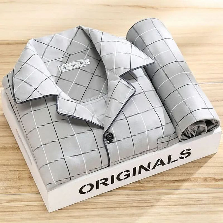 Detail of the classic button-up front and collar on a stylish men's soft pajama set, quality sleepwear.
