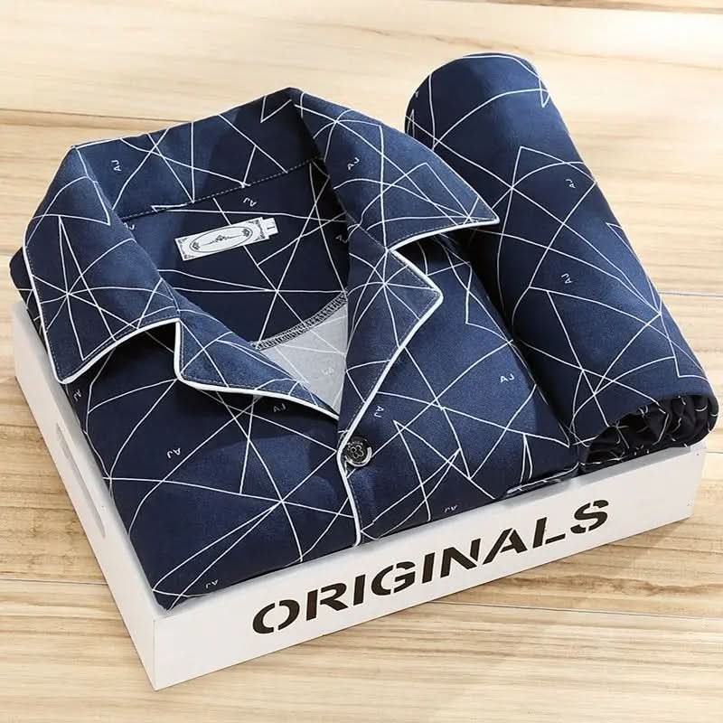 Man reading in a cozy men's button-up pajama set, ultimate loungewear comfort for relaxing evenings.
