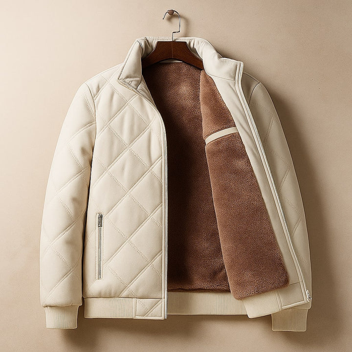 Quilted bomber jacket for men with a stand collar. Modern, stylish outerwear for cold weather. Features a sleek design.