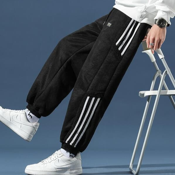 Full shot of men's casual relaxed fit jogger pants in black, showcasing their streetwear appeal