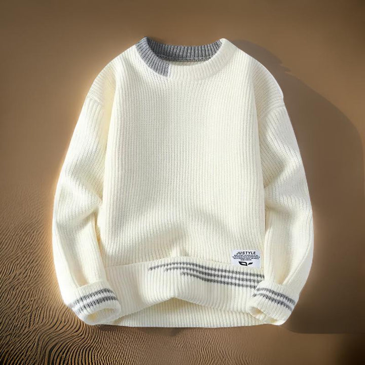 Close-up of a men's striped crewneck sweater, showcasing relaxed fit and texture. Great for stylish fall outfits.