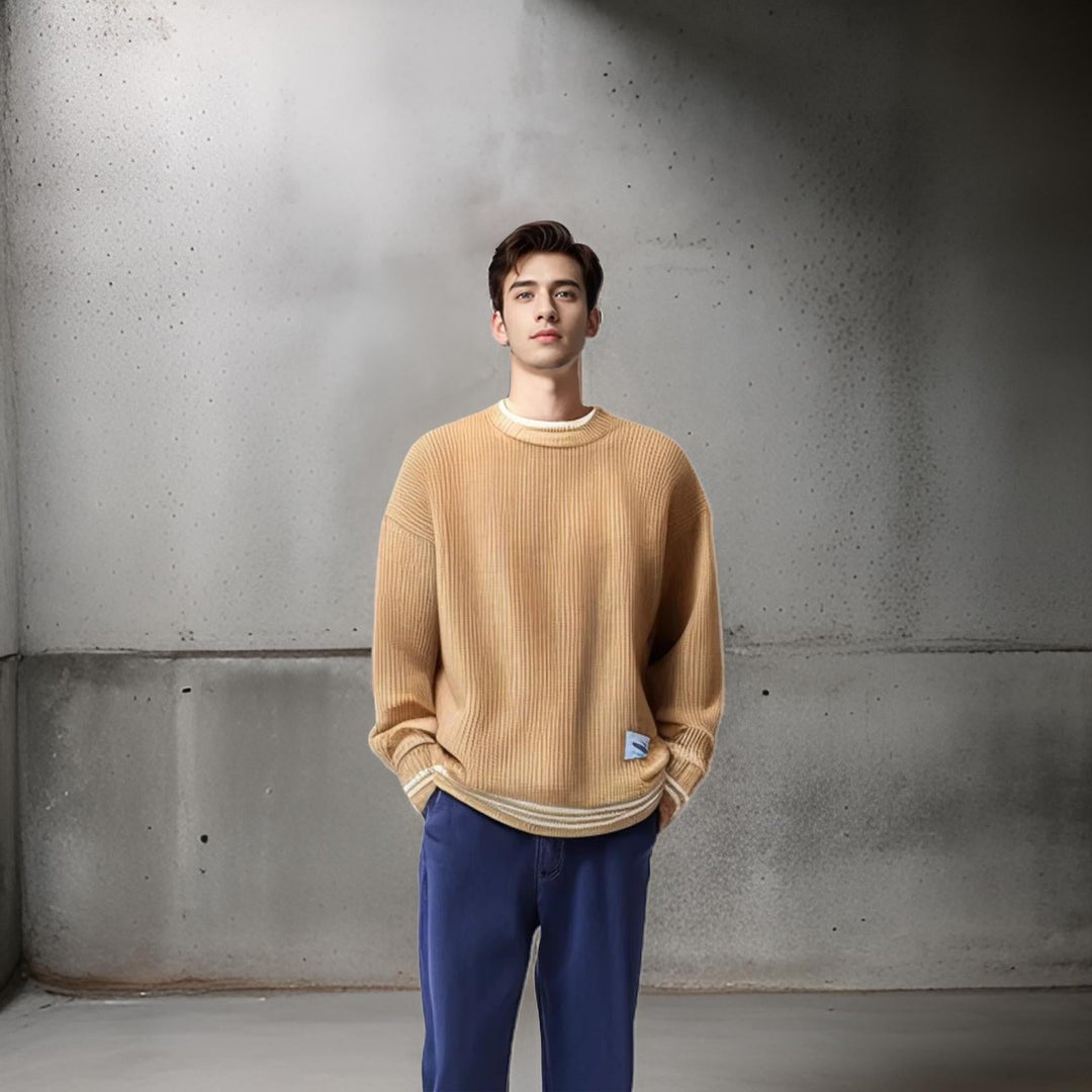 Man wearing a relaxed fit striped crewneck sweater. Casual men's fashion, perfect for a comfortable fall or winter day.