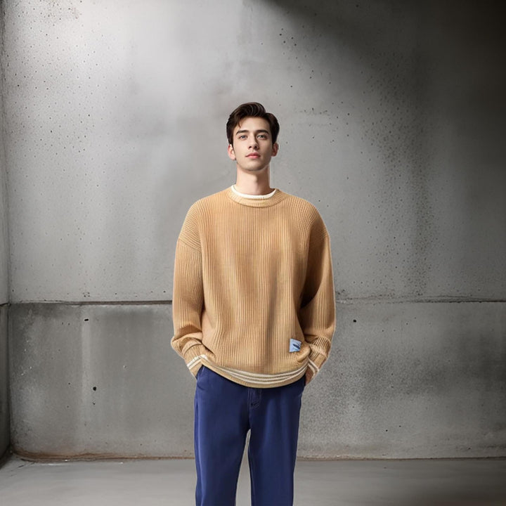 Man wearing a relaxed fit striped crewneck sweater. Casual men's fashion, perfect for a comfortable fall or winter day.