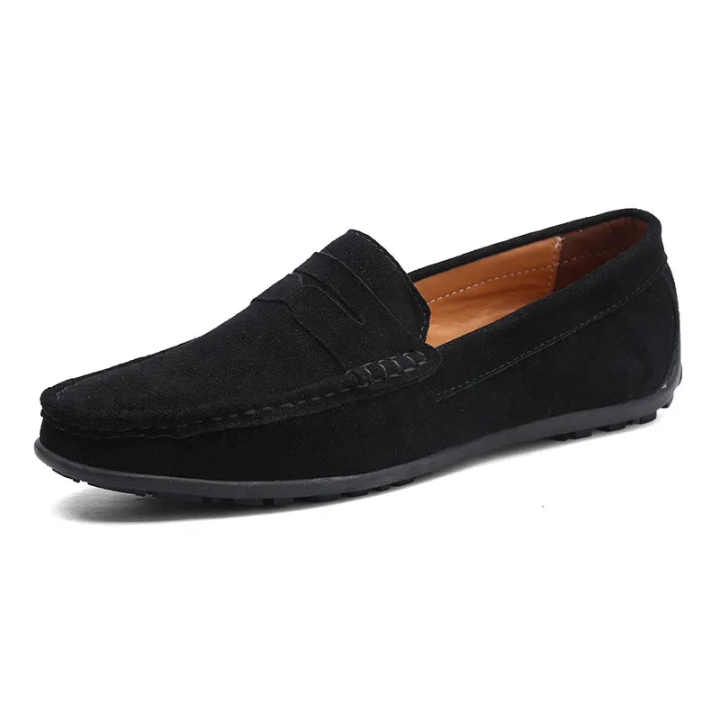 Soft suede men's loafers, offering versatile style from casual to dressy. Comfortable slip-on footwear.