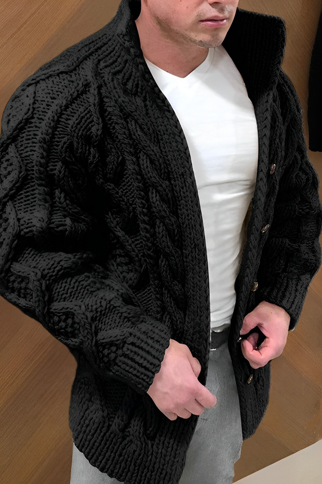 Warm men's cable pattern cardigan, an essential winter layering piece for casual comfort.