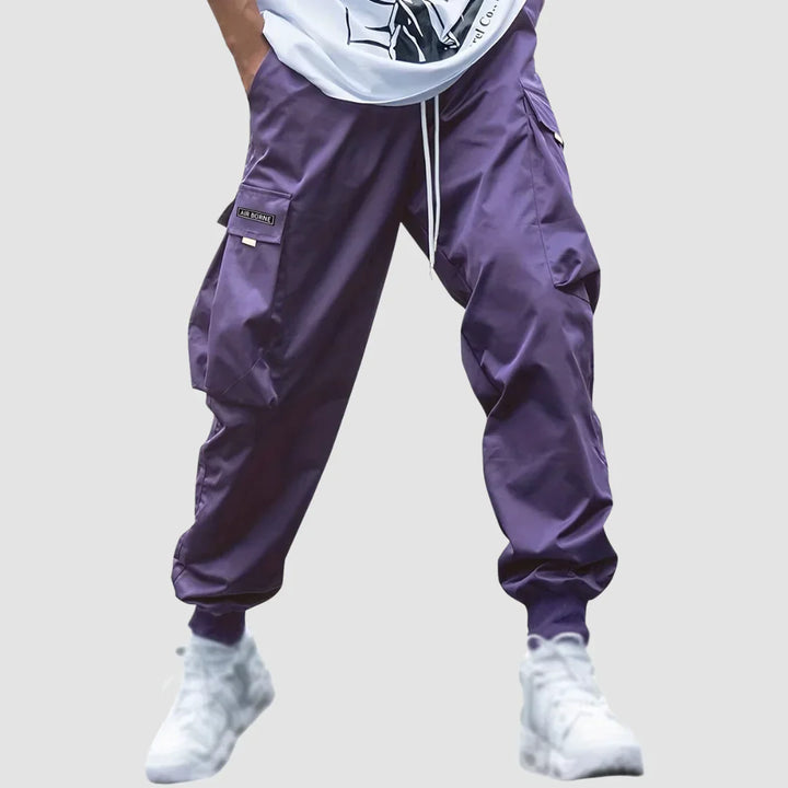 Functional men's tactical cargo pants with multiple pockets, ideal for outdoor adventures & utility.