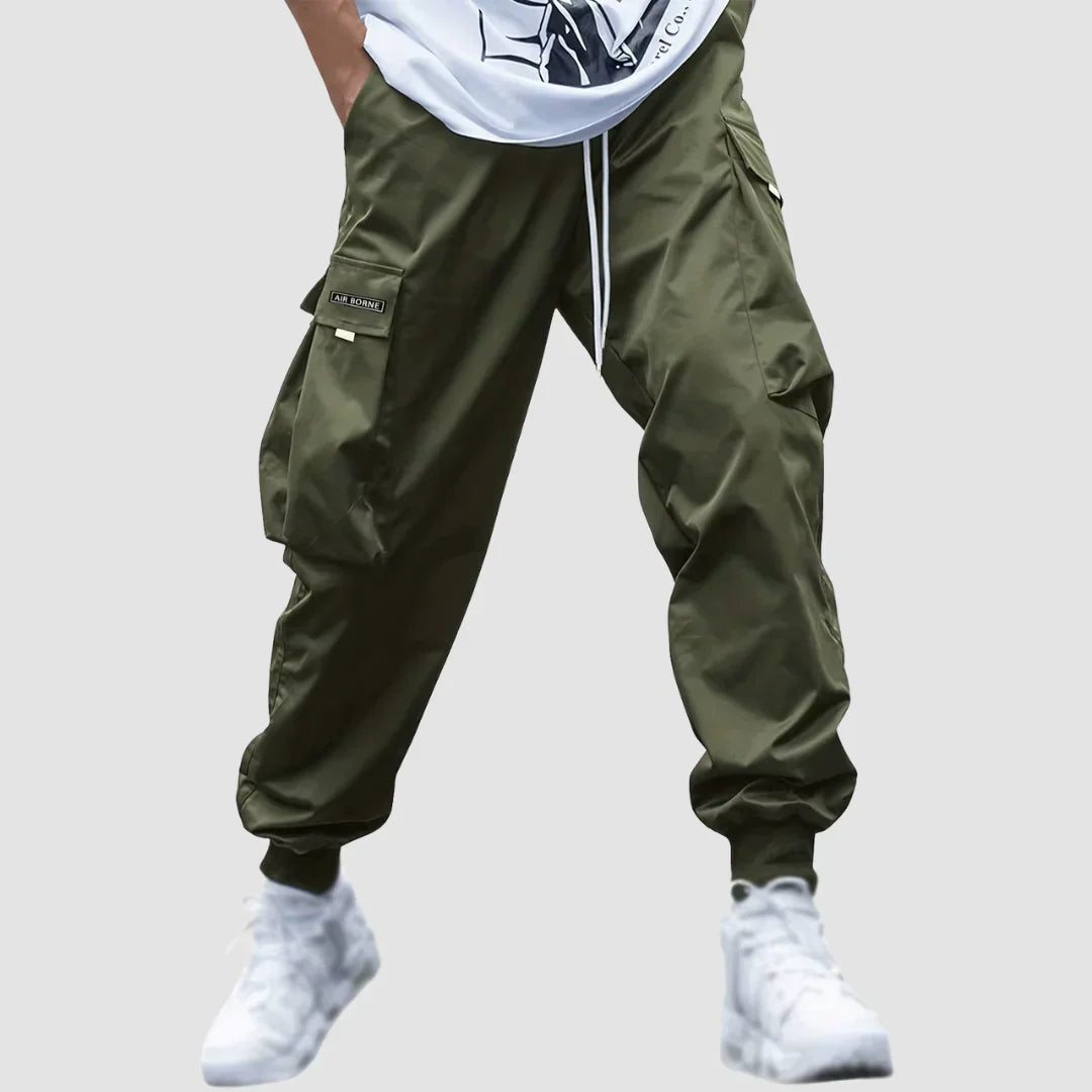 Comfortable stretch men's cargo pants, versatile for all-season wear & active lifestyles. Modern fit.