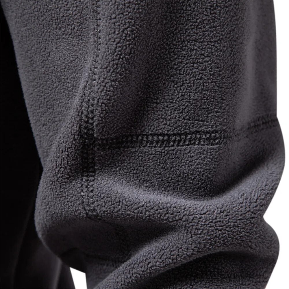 Stylish men's half-zip long sleeve sweater with stand collar, a perfect pullover for versatile casual wear.