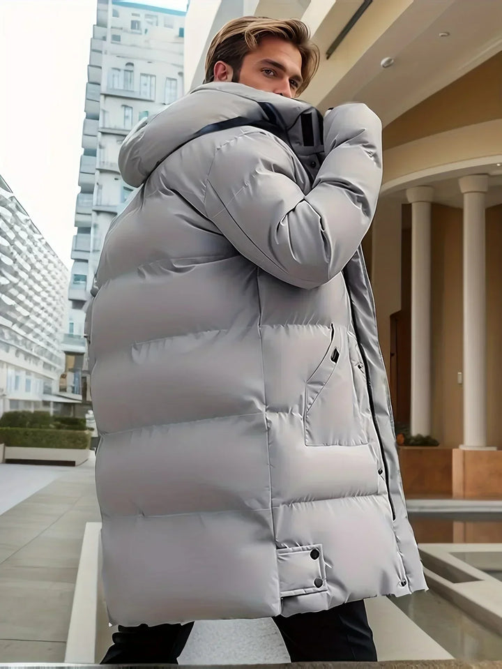 Men's hooded puffer coat, featuring a warm, insulated hood. Ideal stylish outerwear for harsh winter conditions.