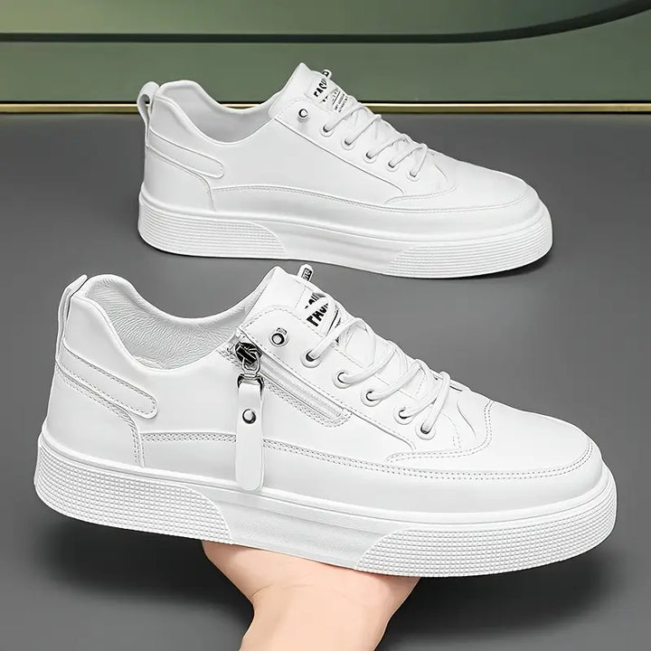 White men's Hudson sneakers with practical side zip closure, ideal for travel & everyday casual wear.