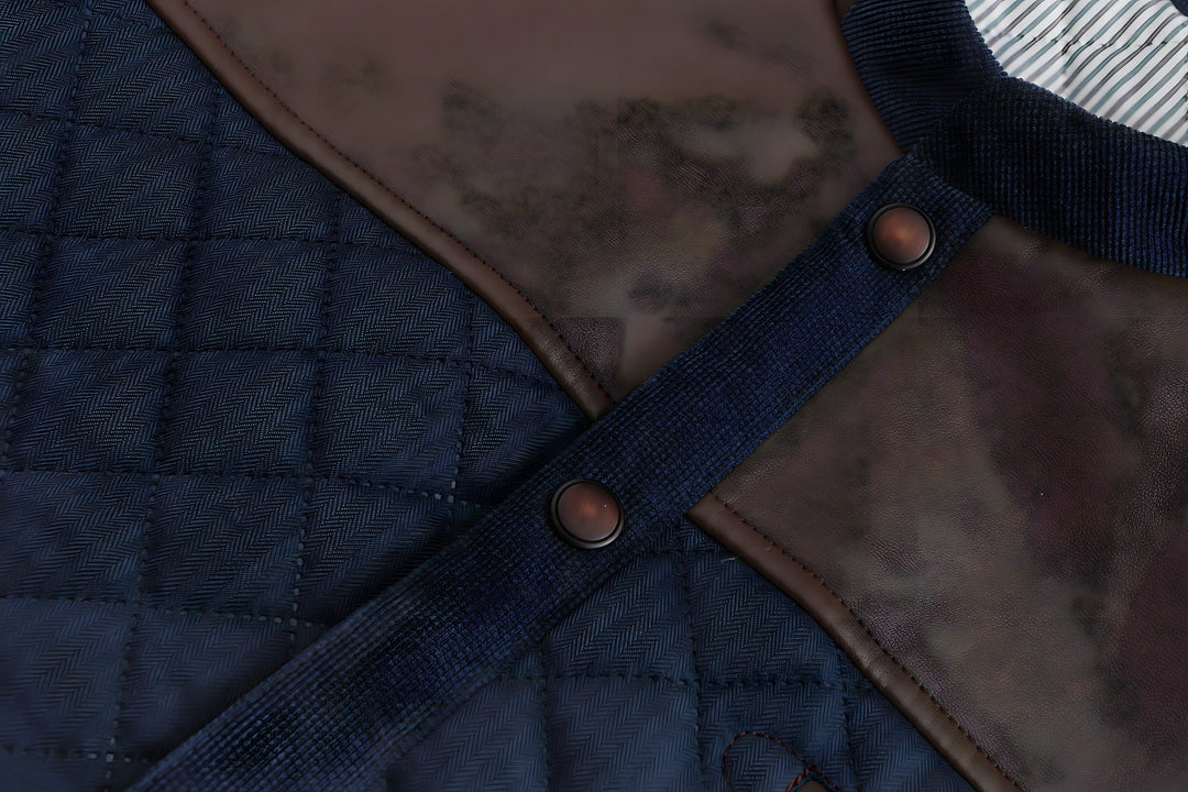 Men's navy blue quilted button-down jacket. Modern everyday outerwear for stylish fall and winter outfits.