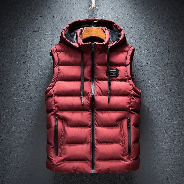Warm men's quilted puffer vest with hood, a stylish choice for active cold weather.
