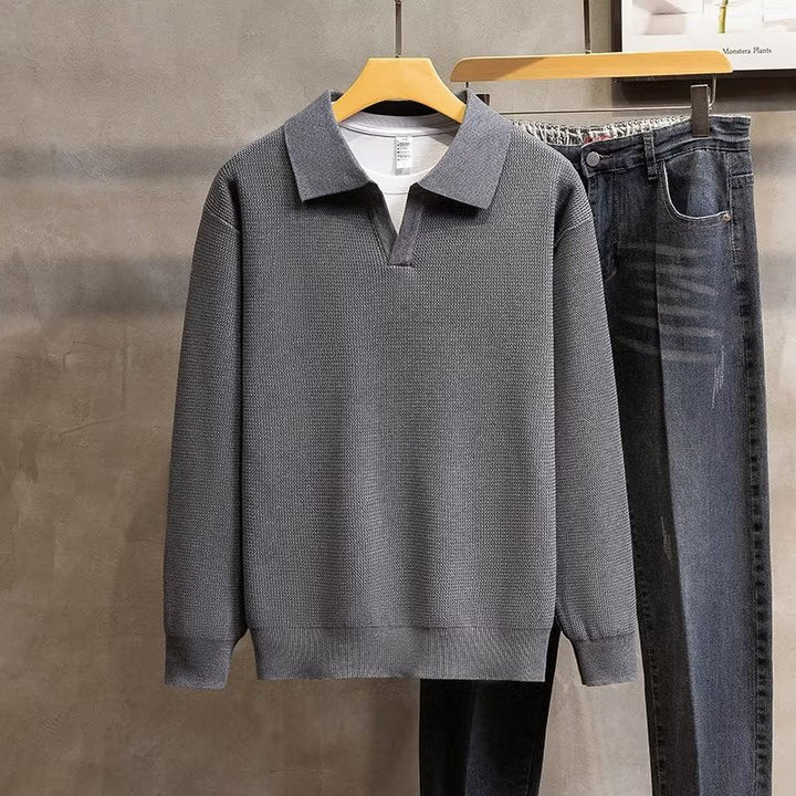 Dynamic shot of men's ribbed polo sweater in smart casual styling for a versatile look.