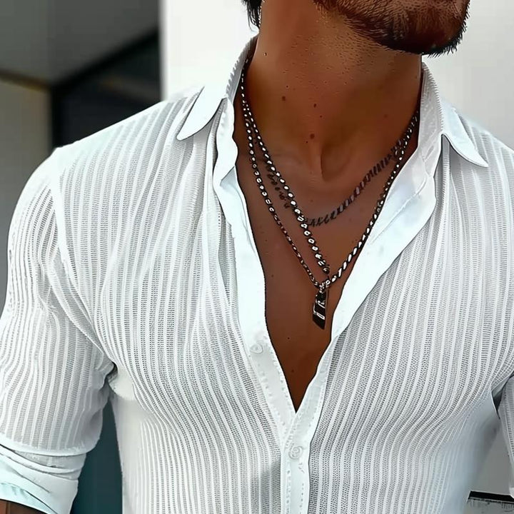 Full view of a men's stylish ribbed long sleeve button front collared shirt.