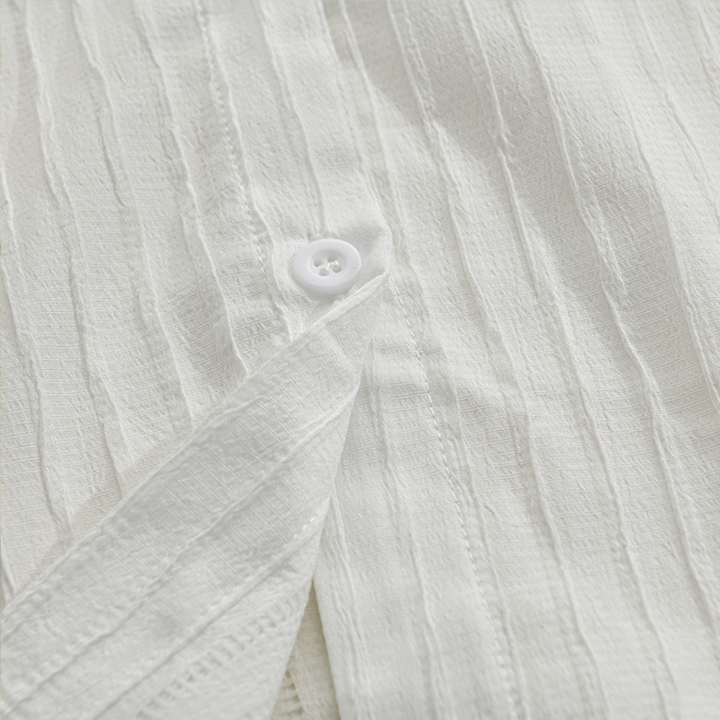 Modern men's stylish long sleeve ribbed shirt with button front, a versatile fashion piece.