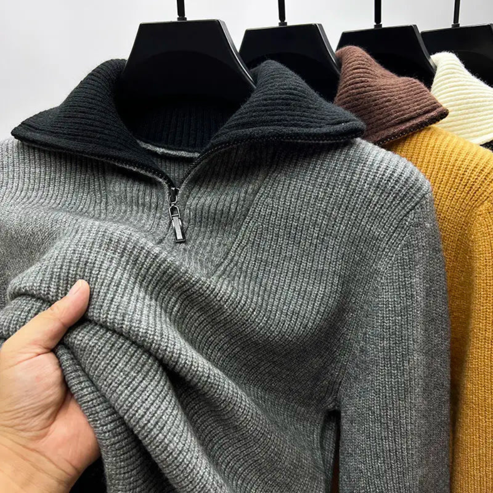 Modern men's quarter-zip sweater with ribbed texture. Stylish color block design, perfect for versatile layering.