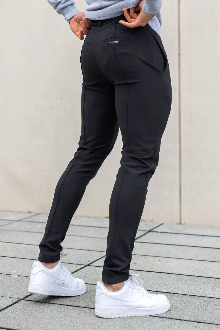 Men wearing stylish slim fit chinos in a modern casual outfit, showcasing their elegant and versatile appeal.